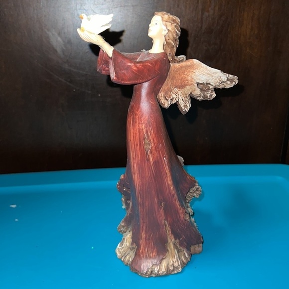 Christmas angel holding turtle dove looks like she’s part of a tree holiday deco - Picture 7 of 7